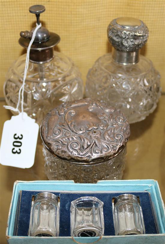 Two silver top scents, cruet etc.
